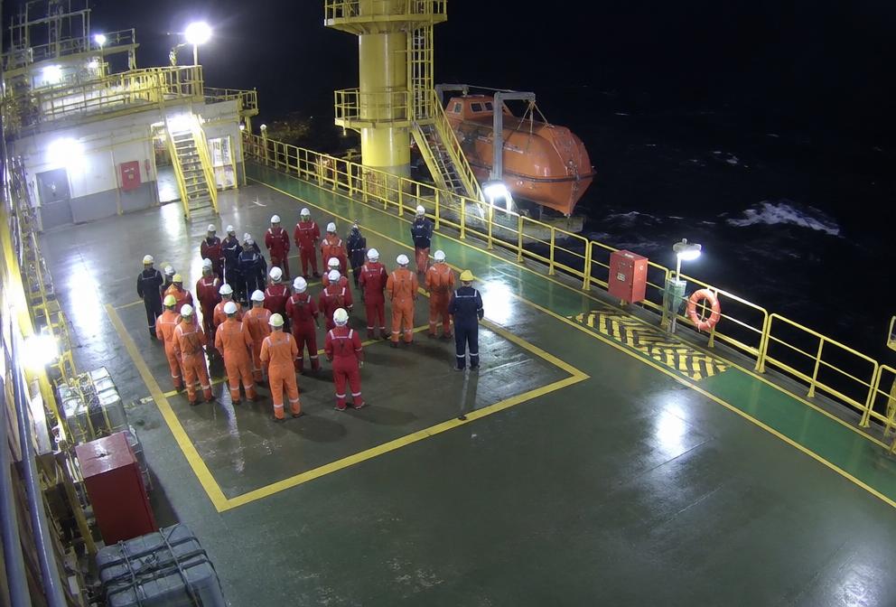 Group of offshore workers at a muster point counted by AI