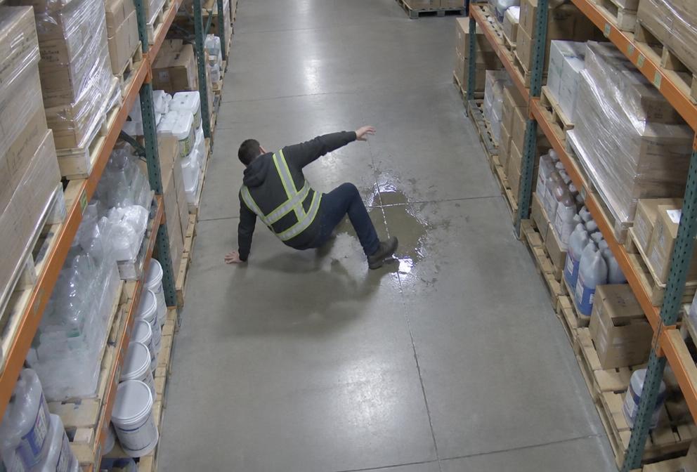 Person fallen on a warehouse floor detected by an AI camera