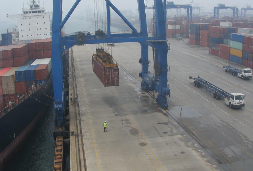Port crane lifting a container above an AI-monitored exclusion zone